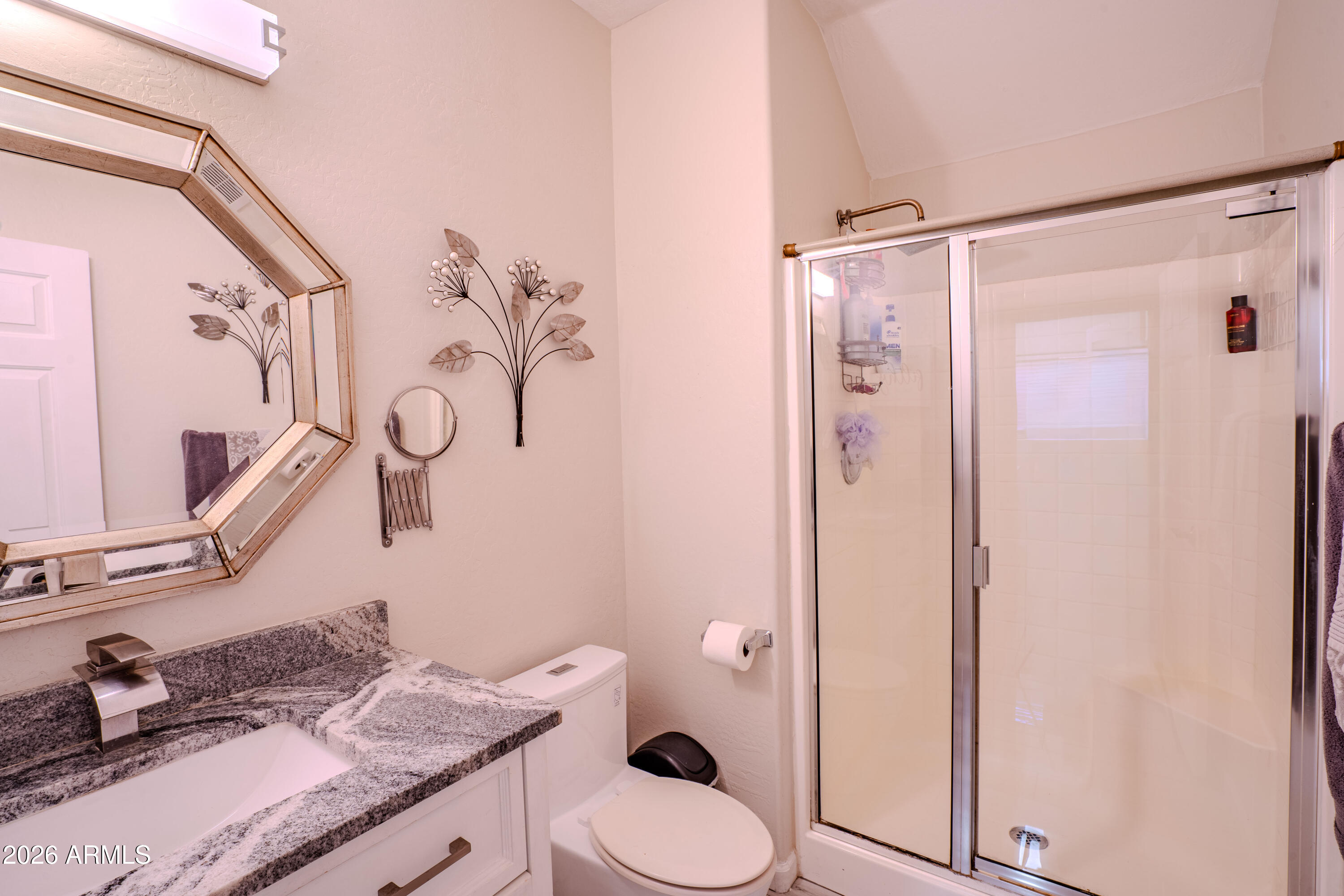 5137 West Grenadine Road Laveen, AZ 85339 - Photo 26 of 53 a bathroom with a granite countertop sink toilet and shower