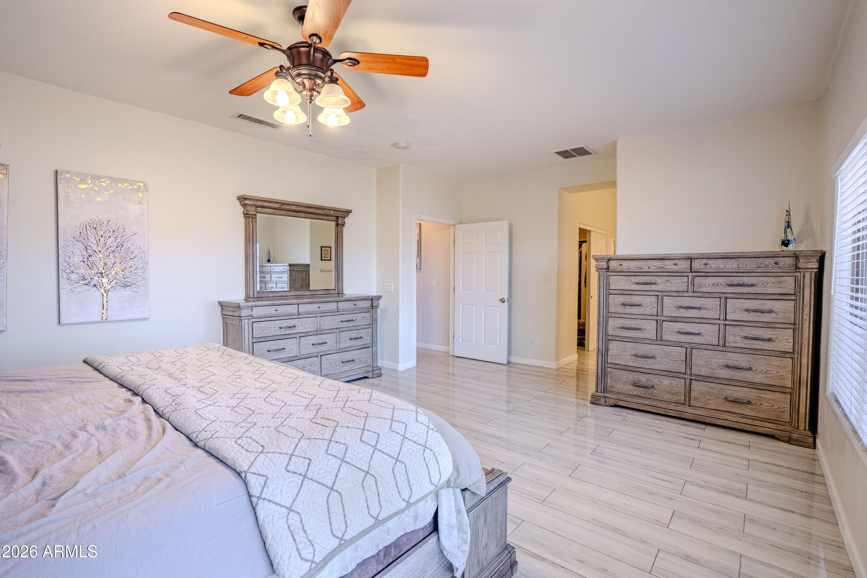 5137 West Grenadine Road Laveen, AZ 85339 - Photo 30 of 53 a bedroom with a bed and a dresser