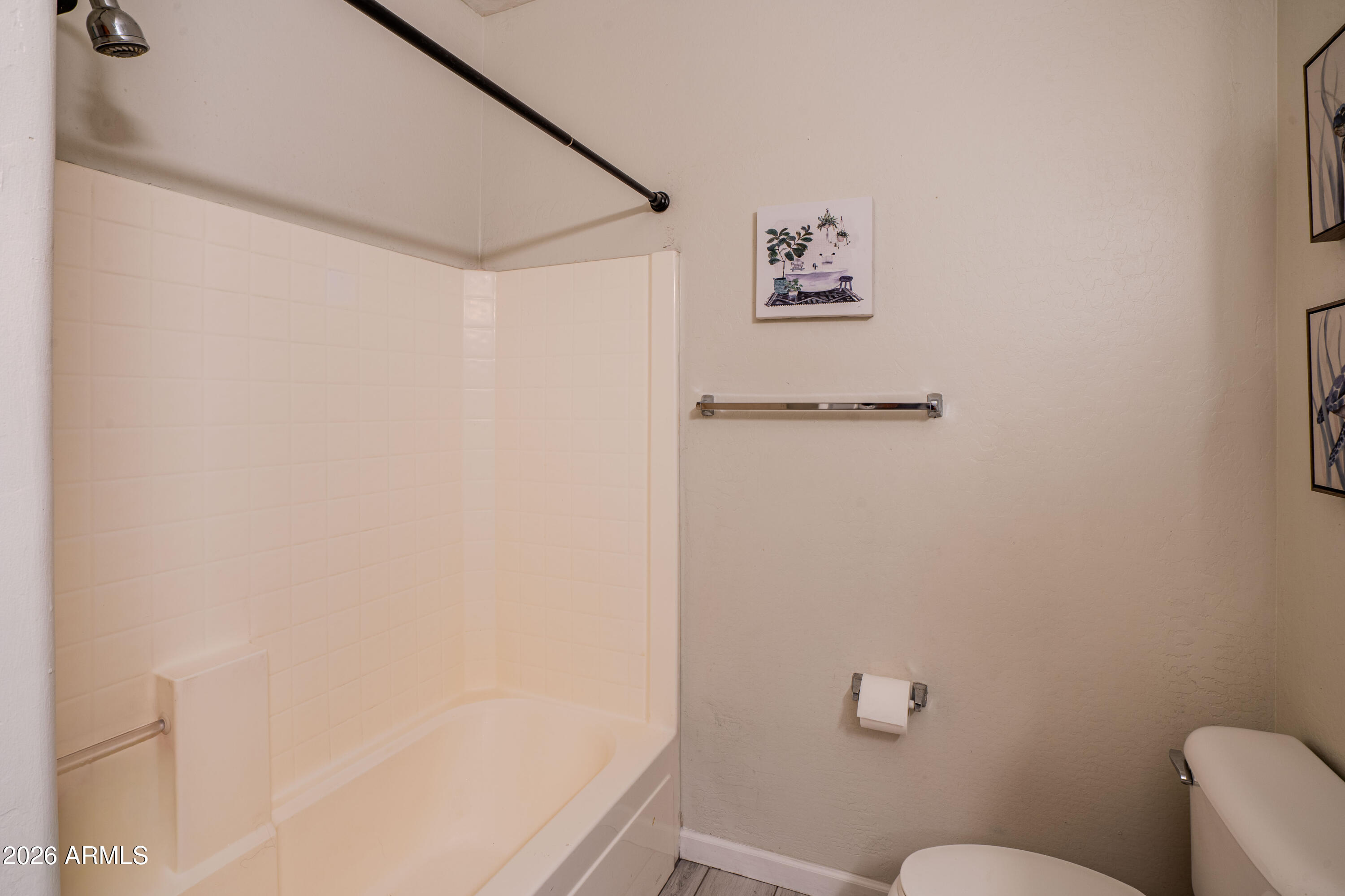 5137 West Grenadine Road Laveen, AZ 85339 - Photo 36 of 53 a bathroom with a shower and a toilet