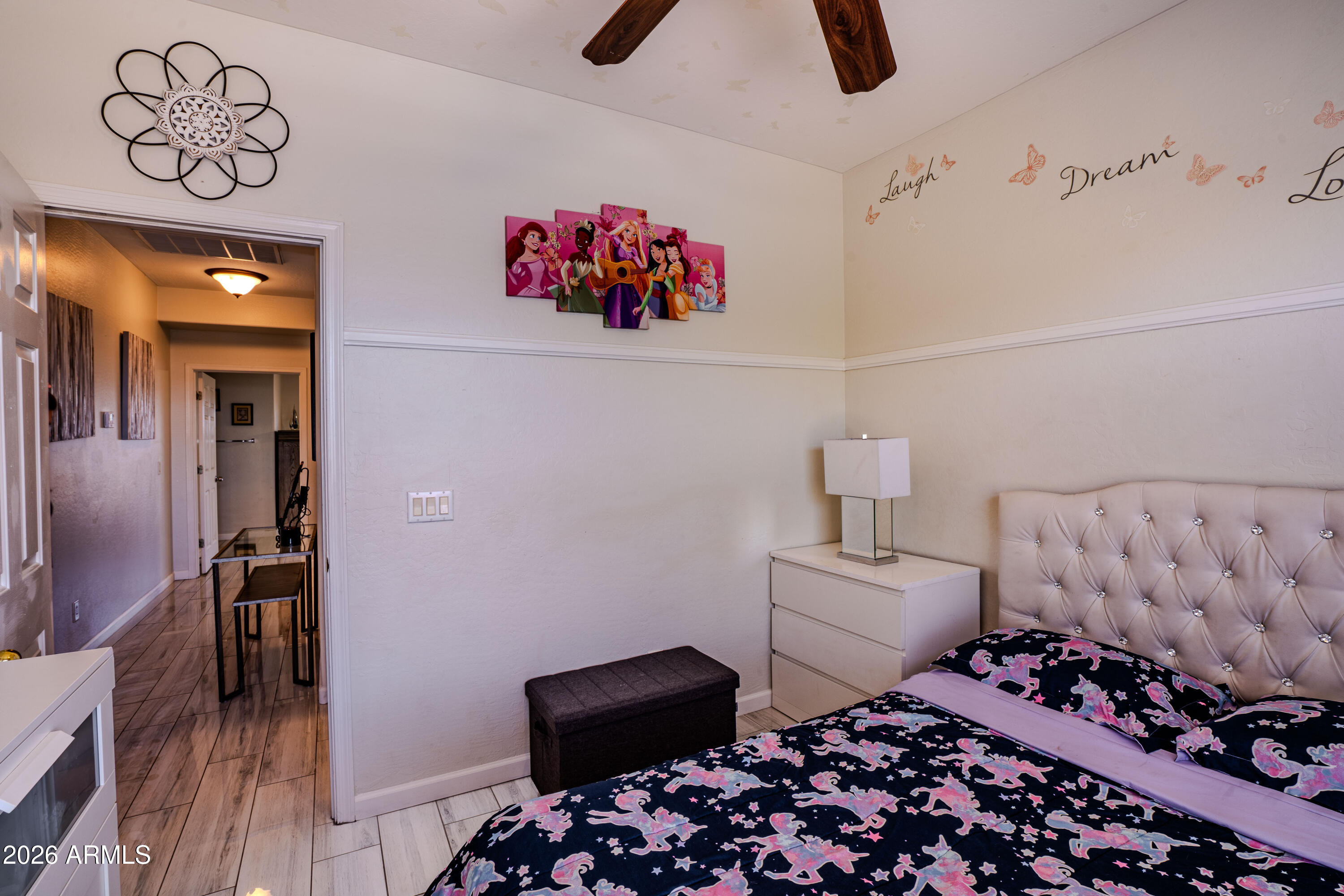 5137 West Grenadine Road Laveen, AZ 85339 - Photo 38 of 53 a bedroom with furniture and wooden floor
