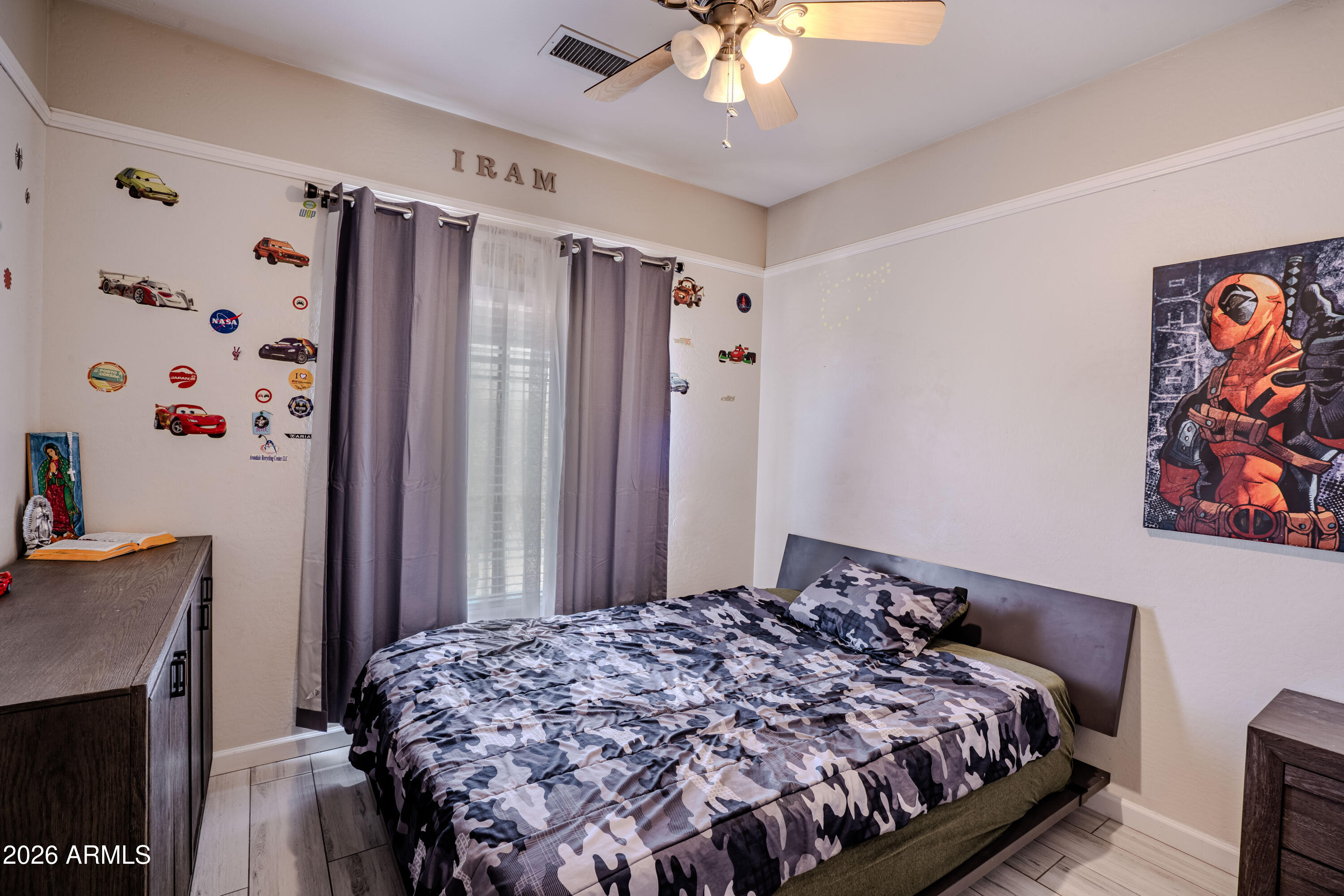 5137 West Grenadine Road Laveen, AZ 85339 - Photo 41 of 53 a bedroom with a bed and a chandelier