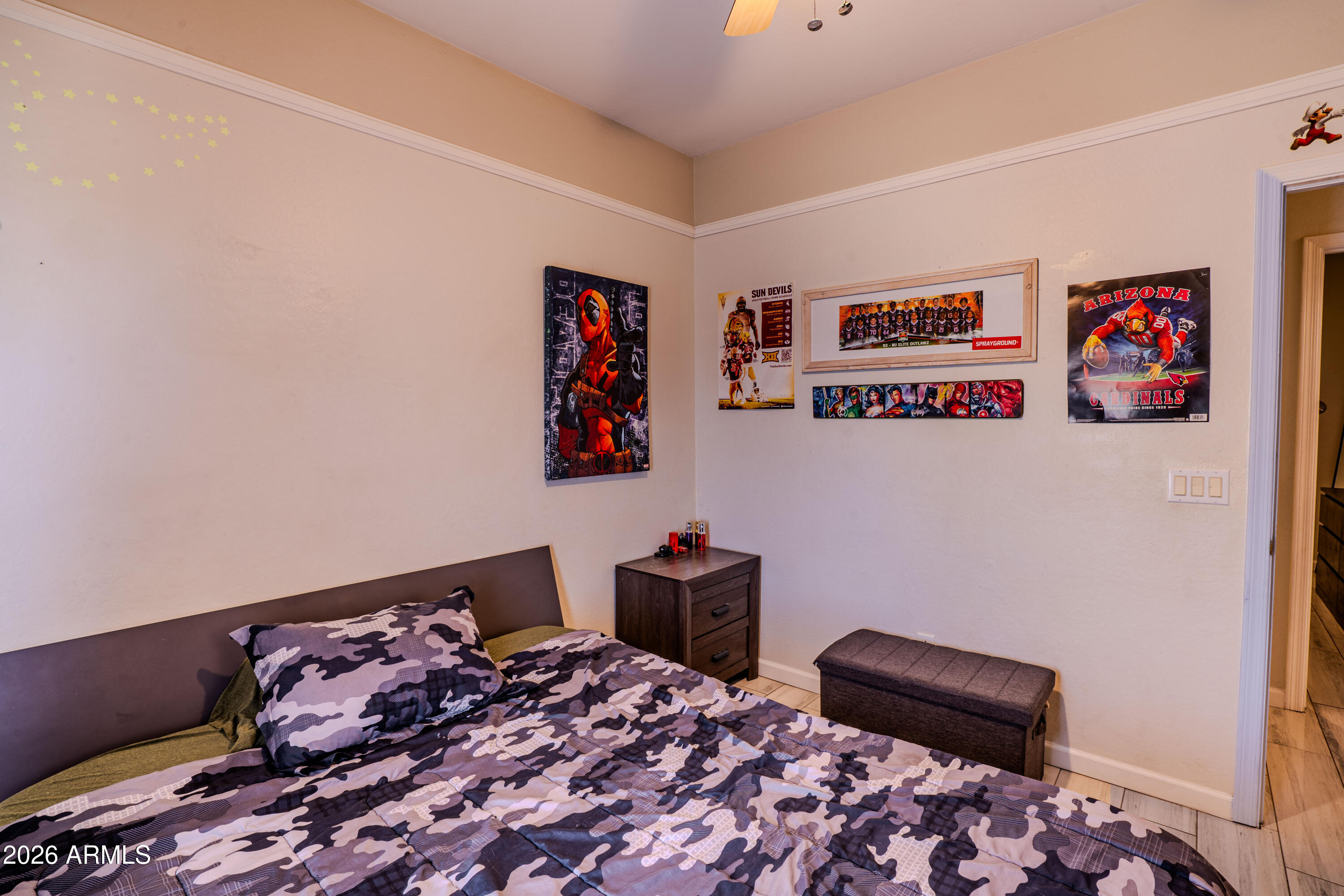 5137 West Grenadine Road Laveen, AZ 85339 - Photo 42 of 53 a bedroom with a bed and cabinets