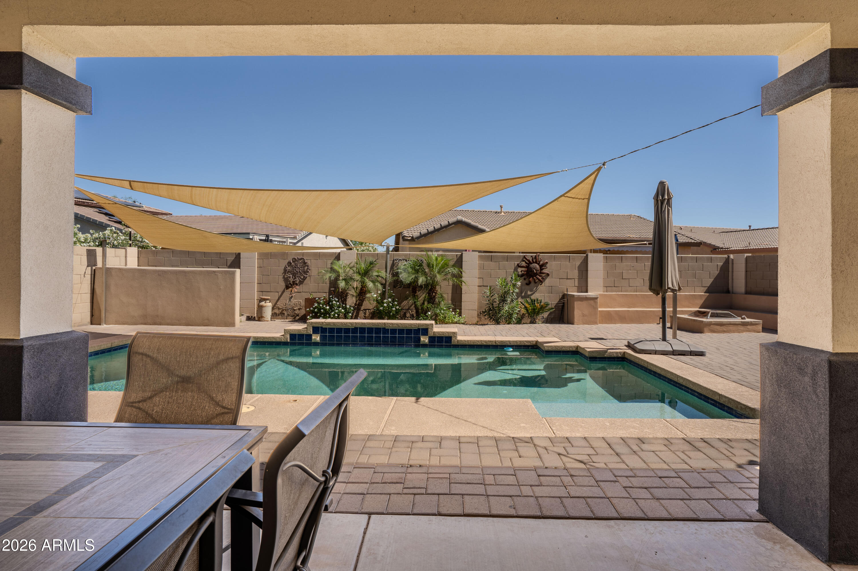 5137 West Grenadine Road Laveen, AZ 85339 - Photo 43 of 53 a view of a backyard with sitting area