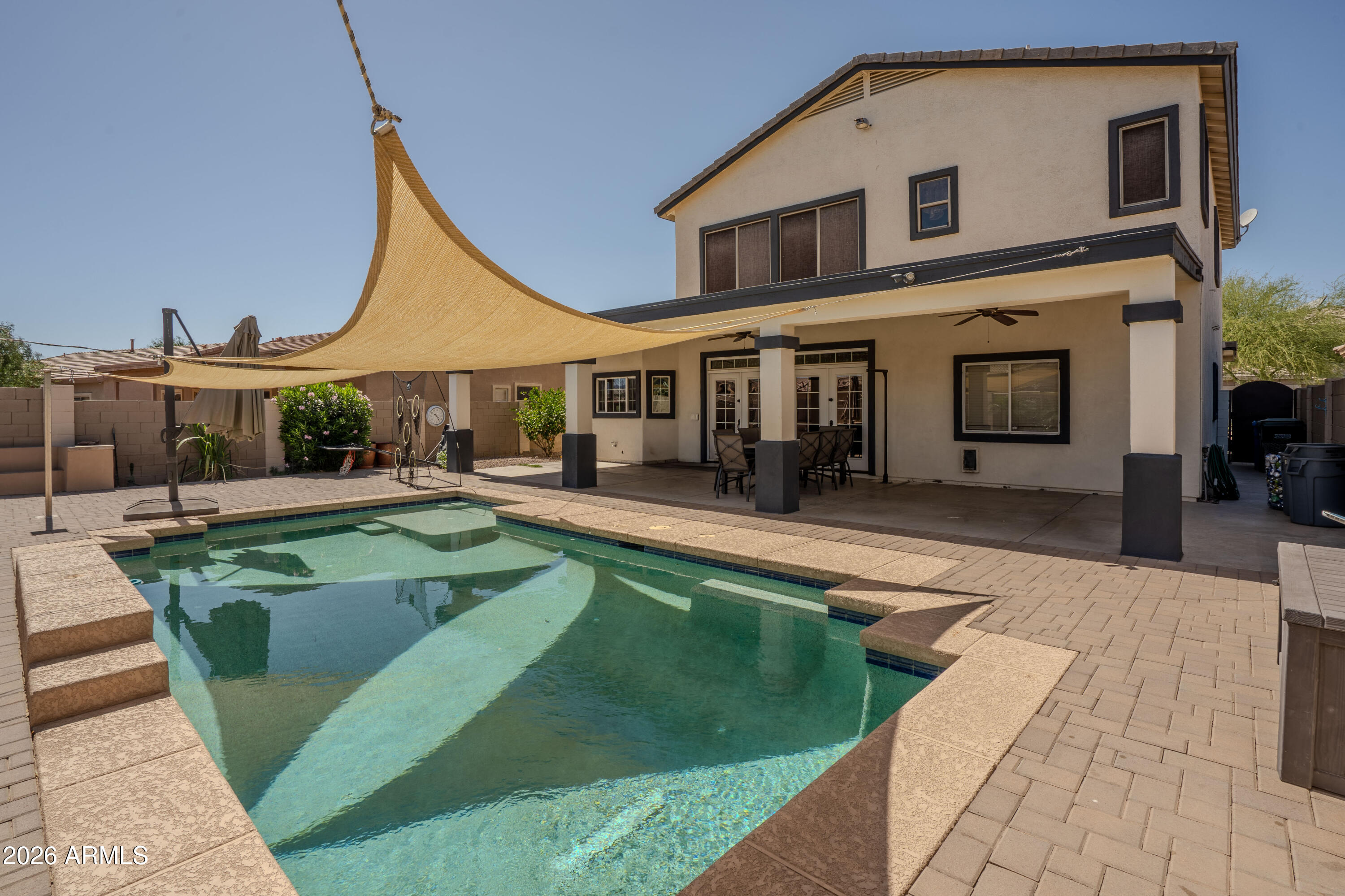 5137 West Grenadine Road Laveen, AZ 85339 - Photo 48 of 53 a view of a house with swimming pool and sitting area