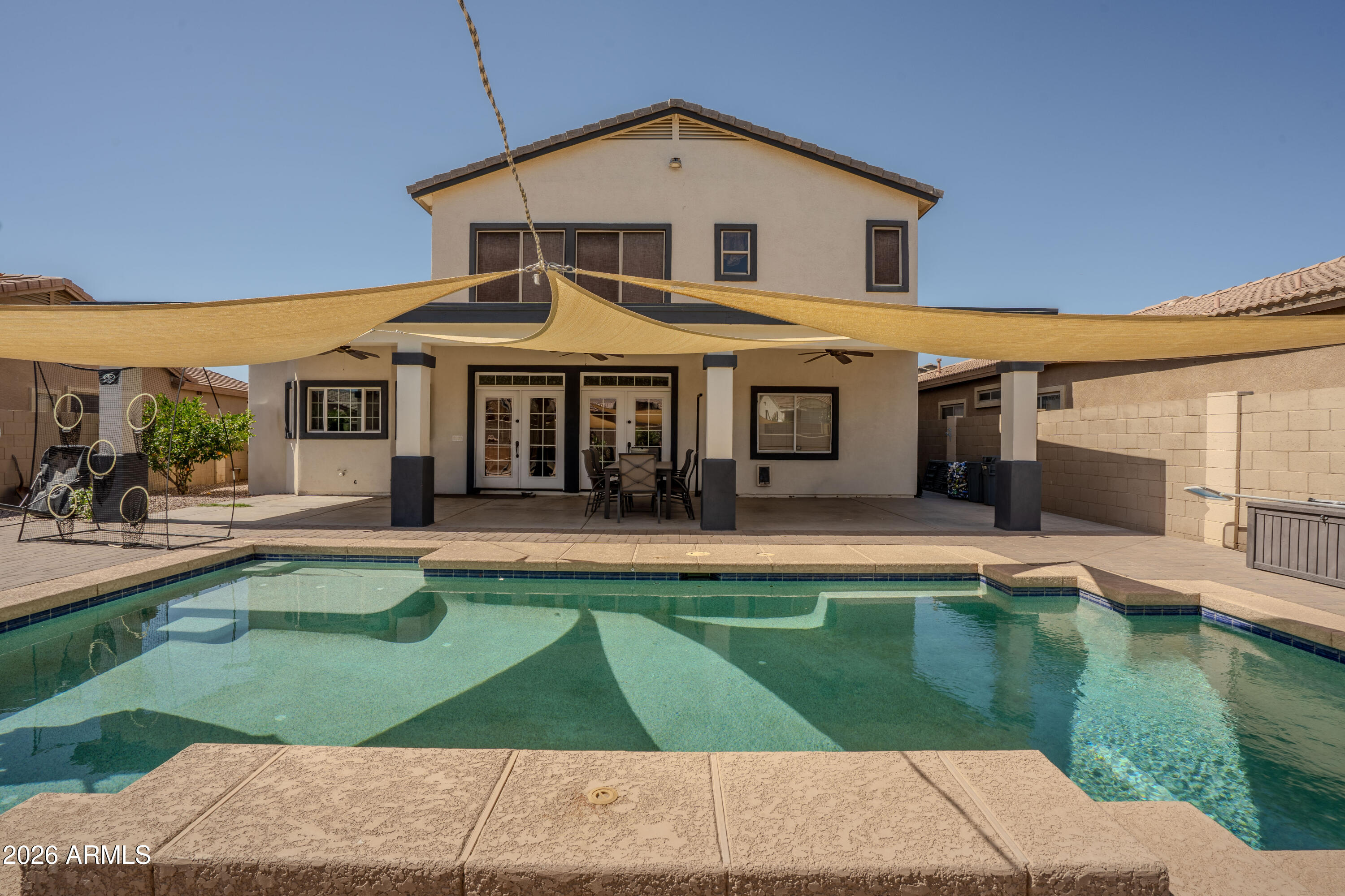 5137 West Grenadine Road Laveen, AZ 85339 - Photo 49 of 53 a view of a house with swimming pool and sitting area