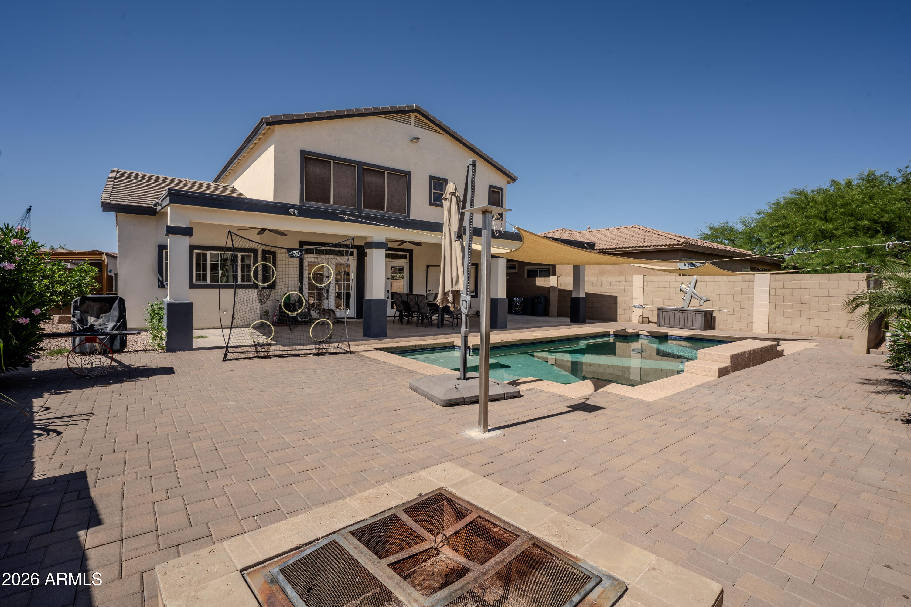 5137 West Grenadine Road Laveen, AZ 85339 - Photo 51 of 53 a front view of a house with porch and sitting area