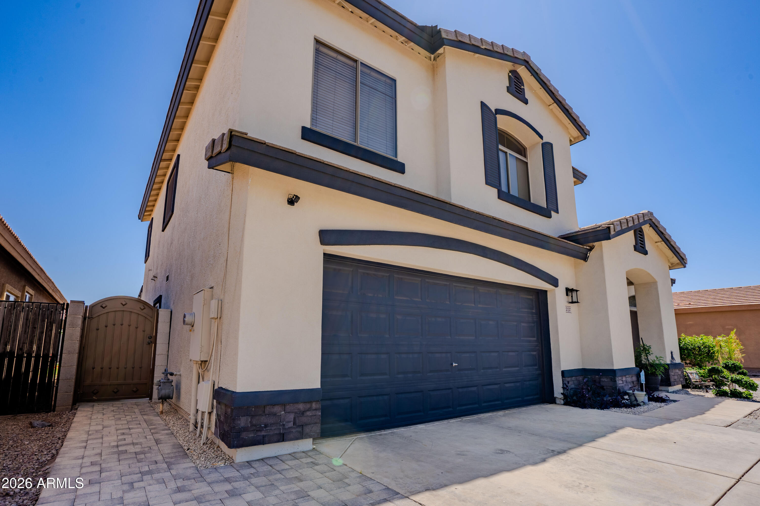 5137 West Grenadine Road Laveen, AZ 85339 - Photo 6 of 53 a front view of a house with a yard
