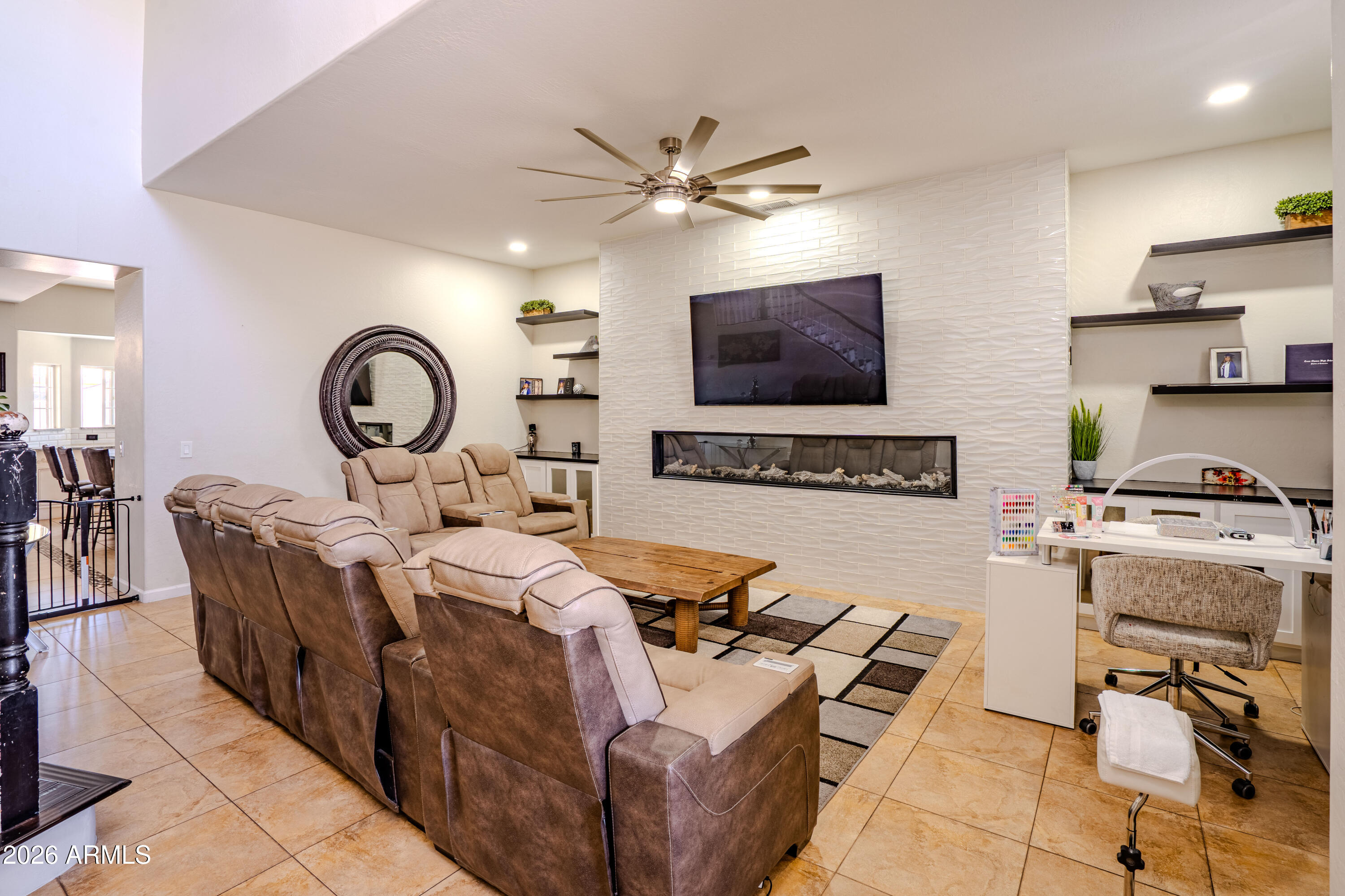 5137 West Grenadine Road Laveen, AZ 85339 - Photo 8 of 53 a living room with furniture a flat screen tv and a window