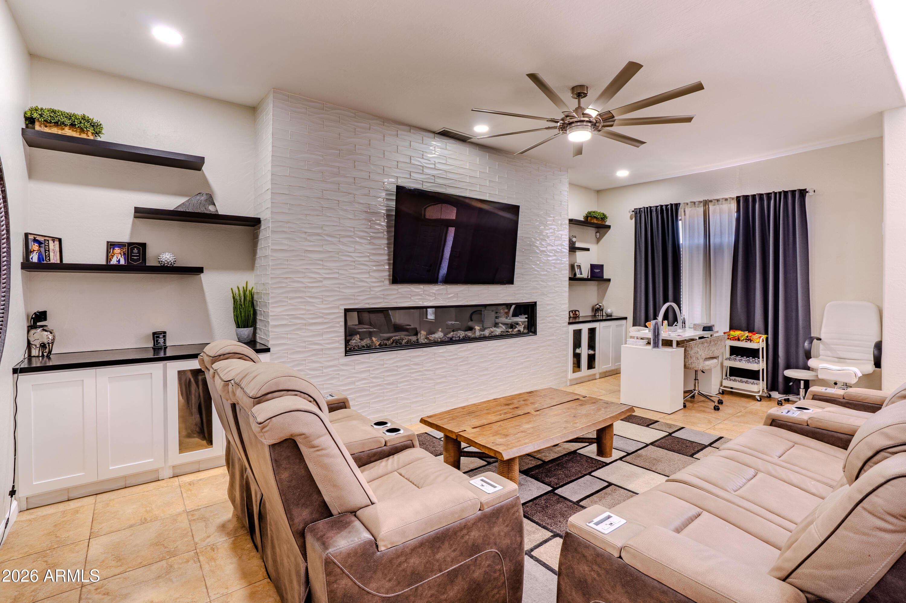 5137 West Grenadine Road Laveen, AZ 85339 - Photo 9 of 53 a living room with furniture and a flat screen tv