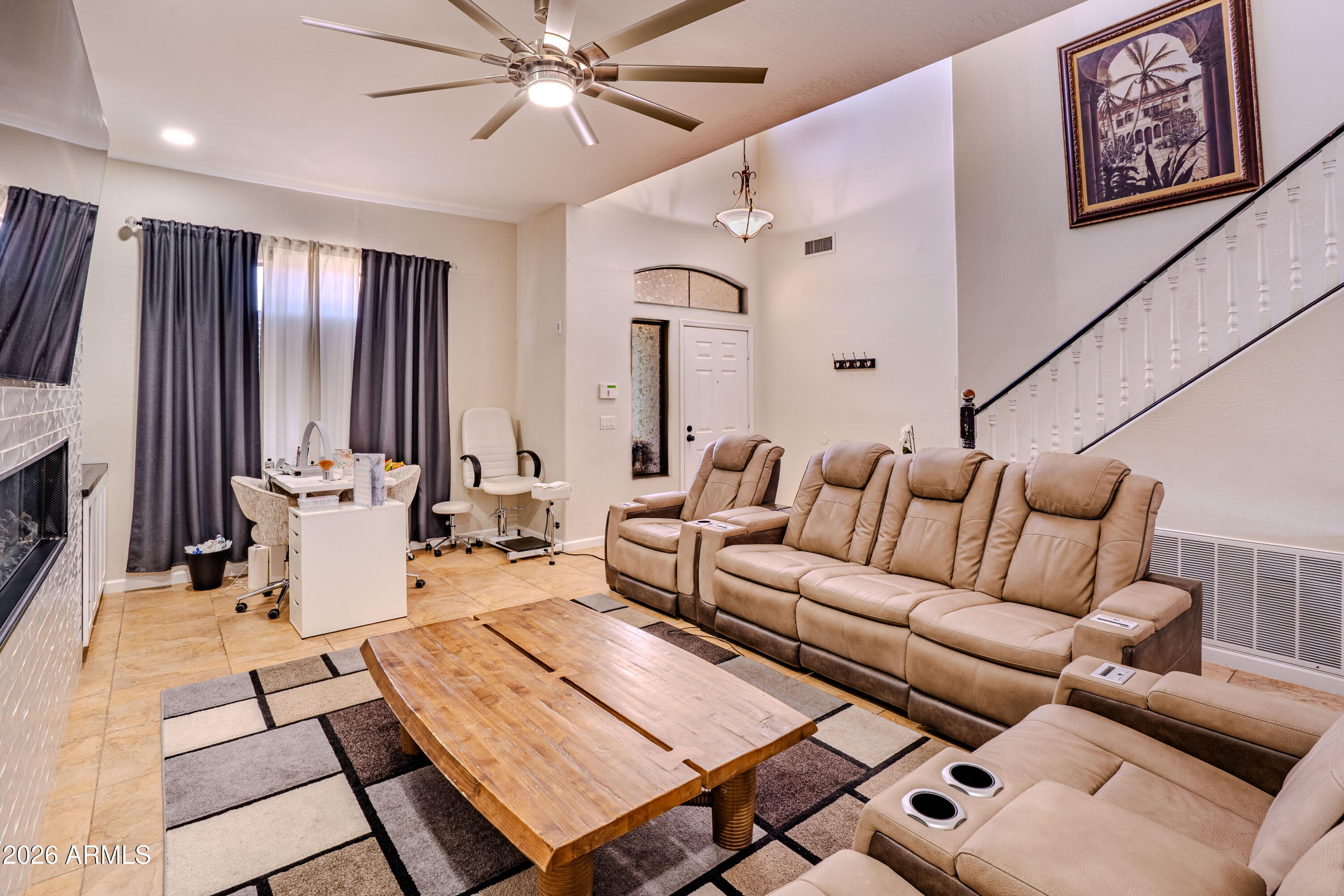 5137 West Grenadine Road Laveen, AZ 85339 - Photo 10 of 53 a living room with furniture and a flat screen tv