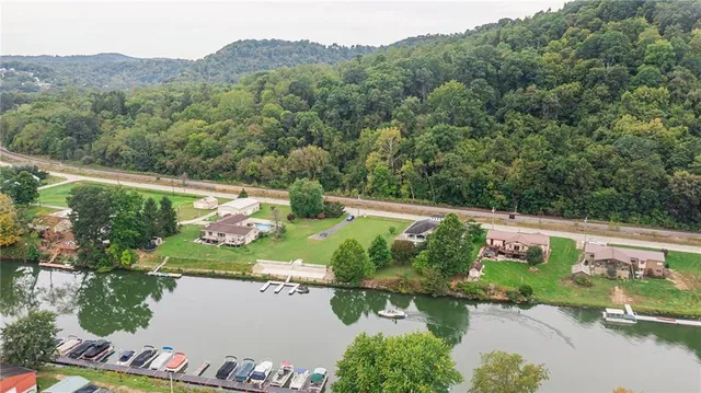 an aerial view of a house with a yard