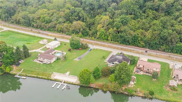 an aerial view of a golf course with chairs