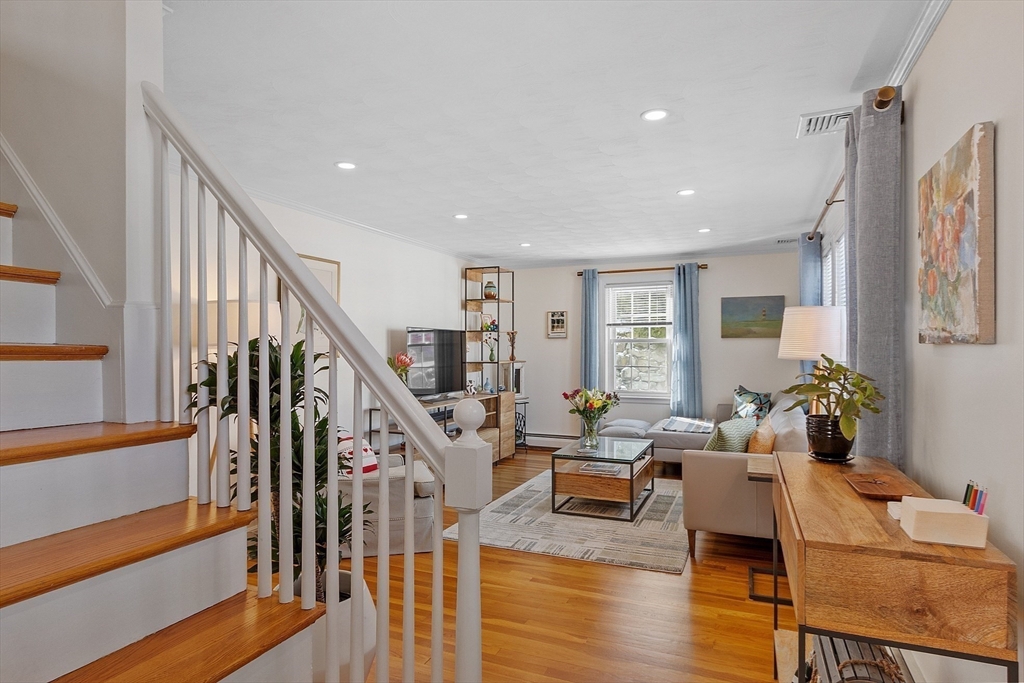 88 Menotomy Road Arlington, MA 02476 - Photo 16 of 40 a living room with furniture and wooden floor