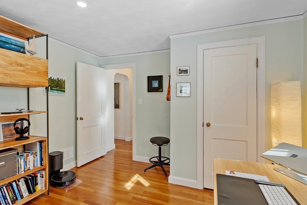 88 Menotomy Road Arlington, MA 02476 - Photo 19 of 40 a view of a workspace with furniture and a window