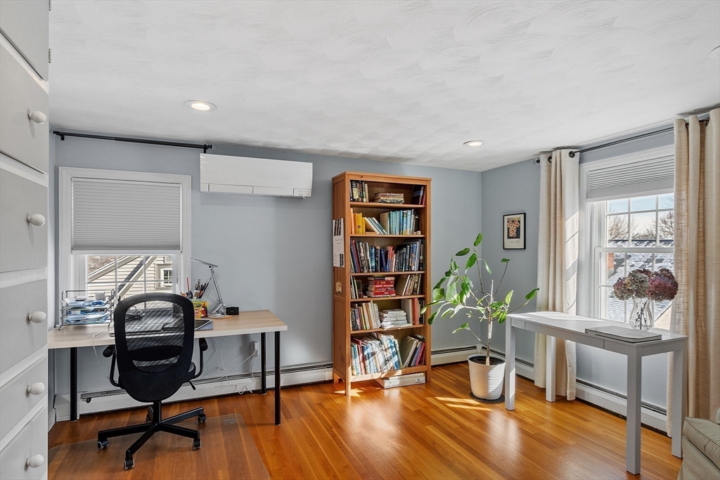 88 Menotomy Road Arlington, MA 02476 - Photo 24 of 40 a view of a workspace with furniture and lounge chair