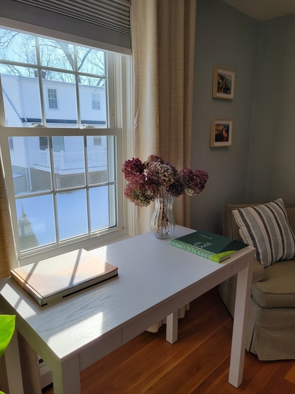 88 Menotomy Road Arlington, MA 02476 - Photo 26 of 40 a view of a room with a table and chairs