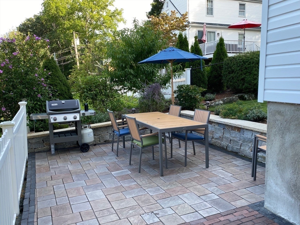88 Menotomy Road Arlington, MA 02476 - Photo 3 of 40 a view of a tables and chairs in patio