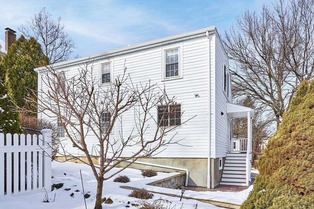 88 Menotomy Road Arlington, MA 02476 - Photo 31 of 40 a view of a house with a yard