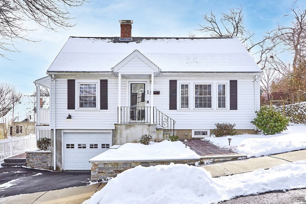 88 Menotomy Road Arlington, MA 02476 - Photo 35 of 40 a front view of a house with a yard