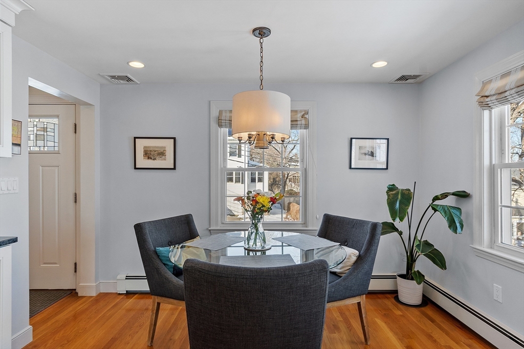 88 Menotomy Road Arlington, MA 02476 - Photo 10 of 40 a view of a dining room with furniture window and wooden floor