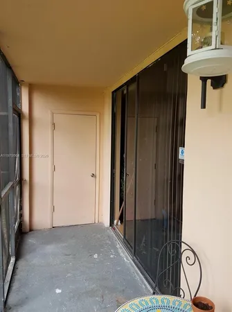 a view of a door and an entryway in a room