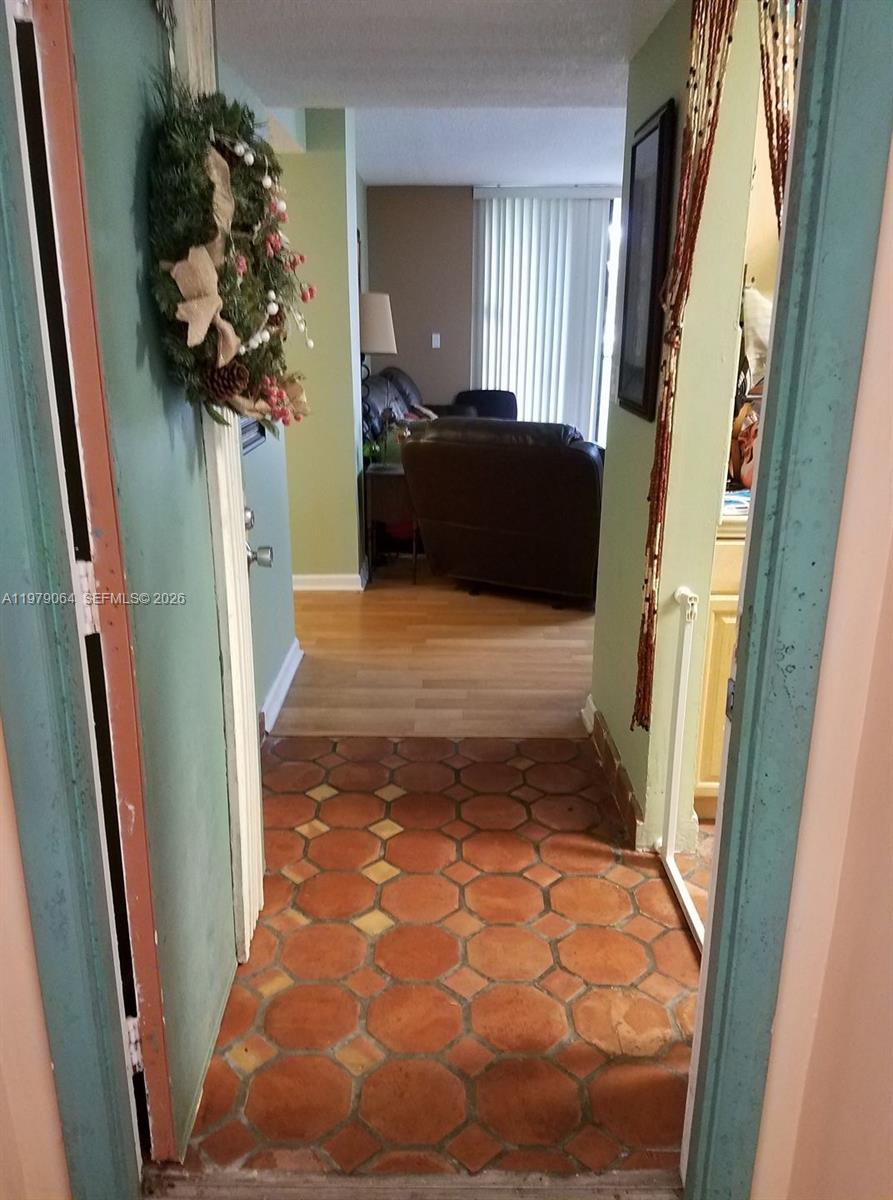 8500 Southwest 133rd Avenue Road, Unit 108 Miami, FL 33183 - Photo 3 of 17 a hallway with window