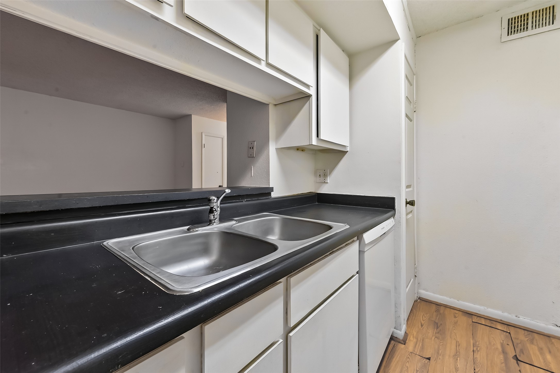 2800 Jeanetta Street, Unit 2003 Houston, TX 77063 - Photo 12 of 24 a kitchen with a sink and cabinets
