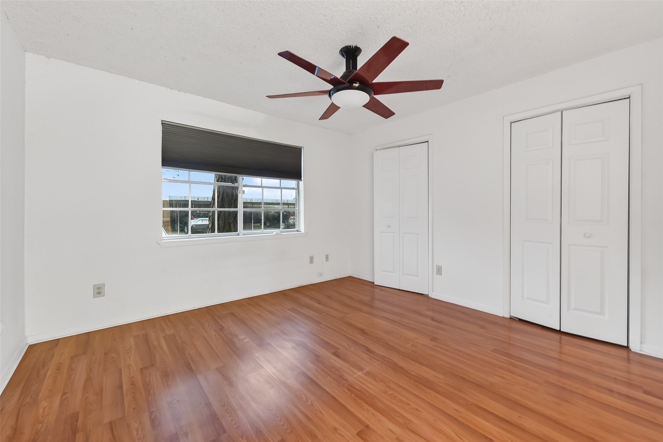 2800 Jeanetta Street, Unit 2003 Houston, TX 77063 - Photo 16 of 24 a view of empty room with wooden floor and ceiling fan