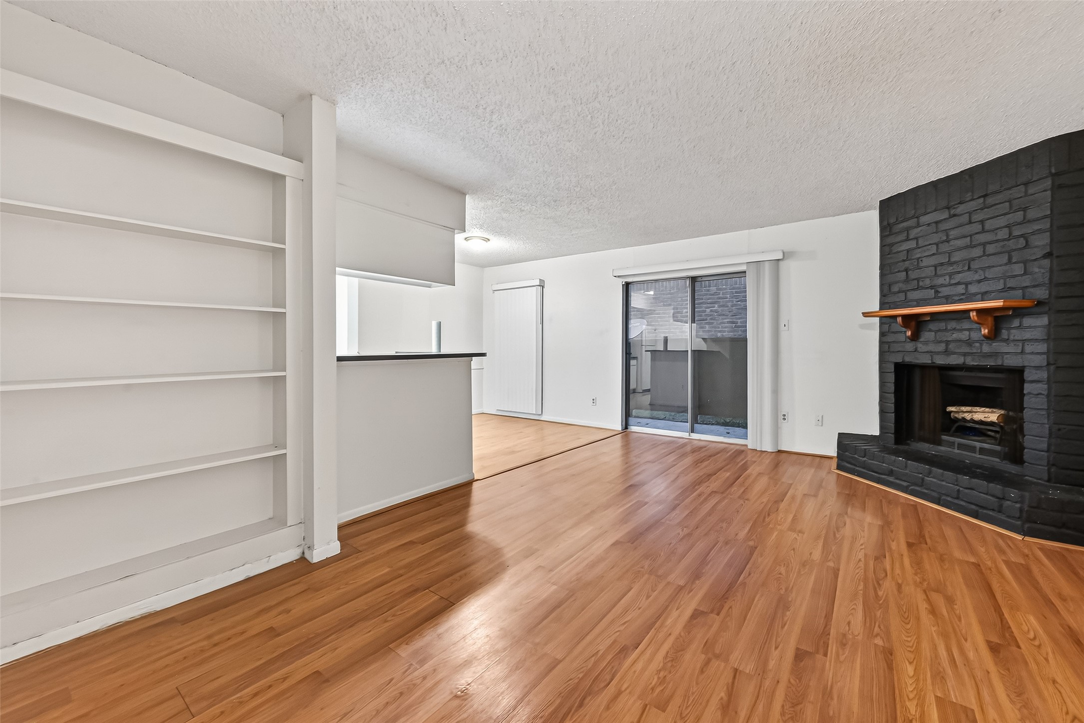 2800 Jeanetta Street, Unit 2003 Houston, TX 77063 - Photo 4 of 24 a view of empty room with wooden floor and a window