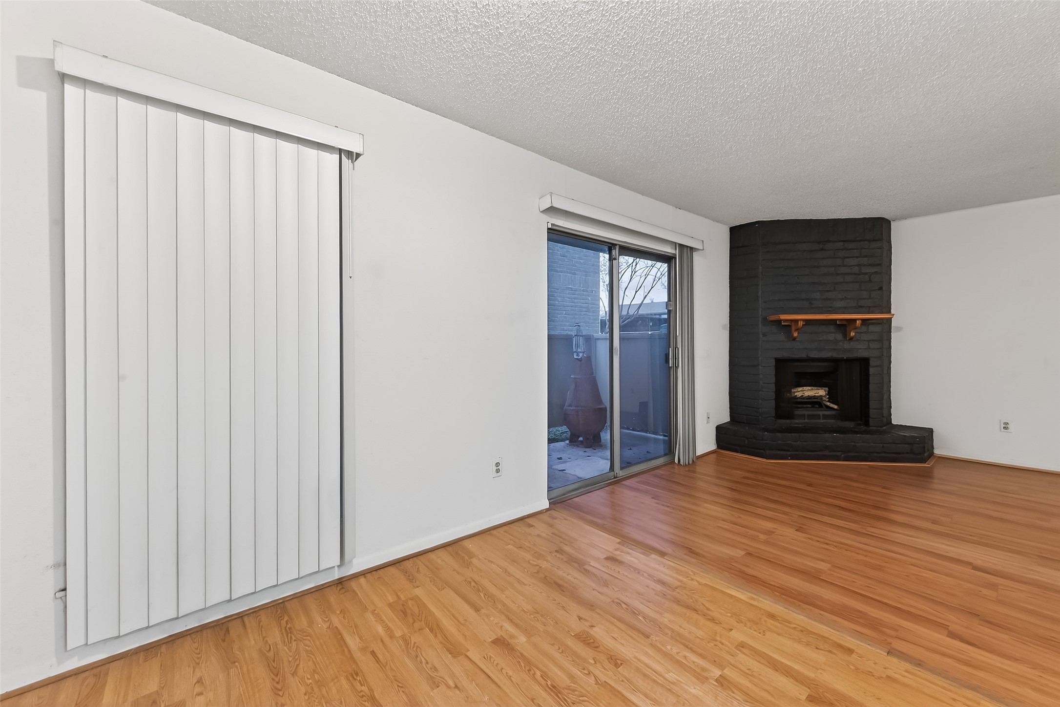2800 Jeanetta Street, Unit 2003 Houston, TX 77063 - Photo 10 of 24 wooden floor fireplace and natural light in room