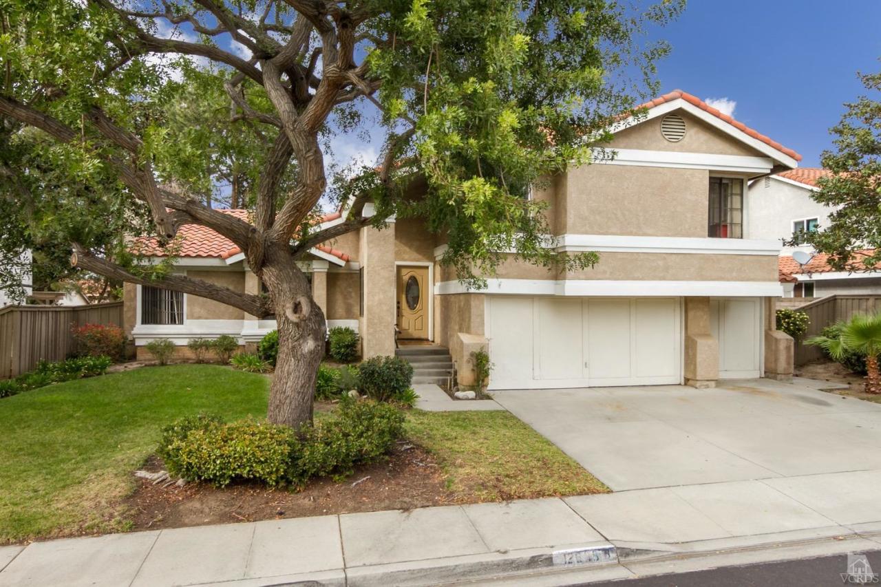 12685 Crystal Ranch Road Moorpark, CA 93021 - Photo 1 of 25 a front view of a house with garden