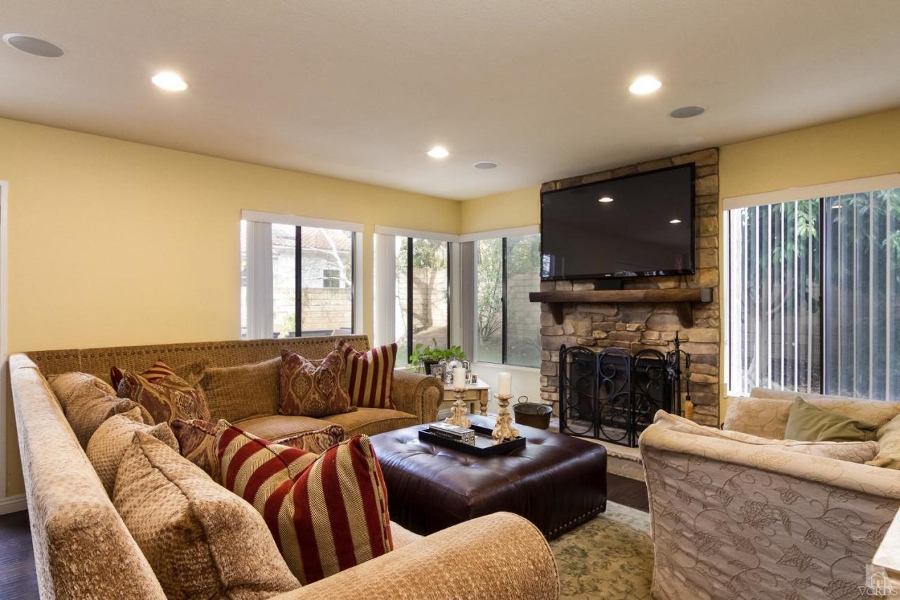 12685 Crystal Ranch Road Moorpark, CA 93021 - Photo 11 of 25 a living room with furniture fireplace and a flat screen tv