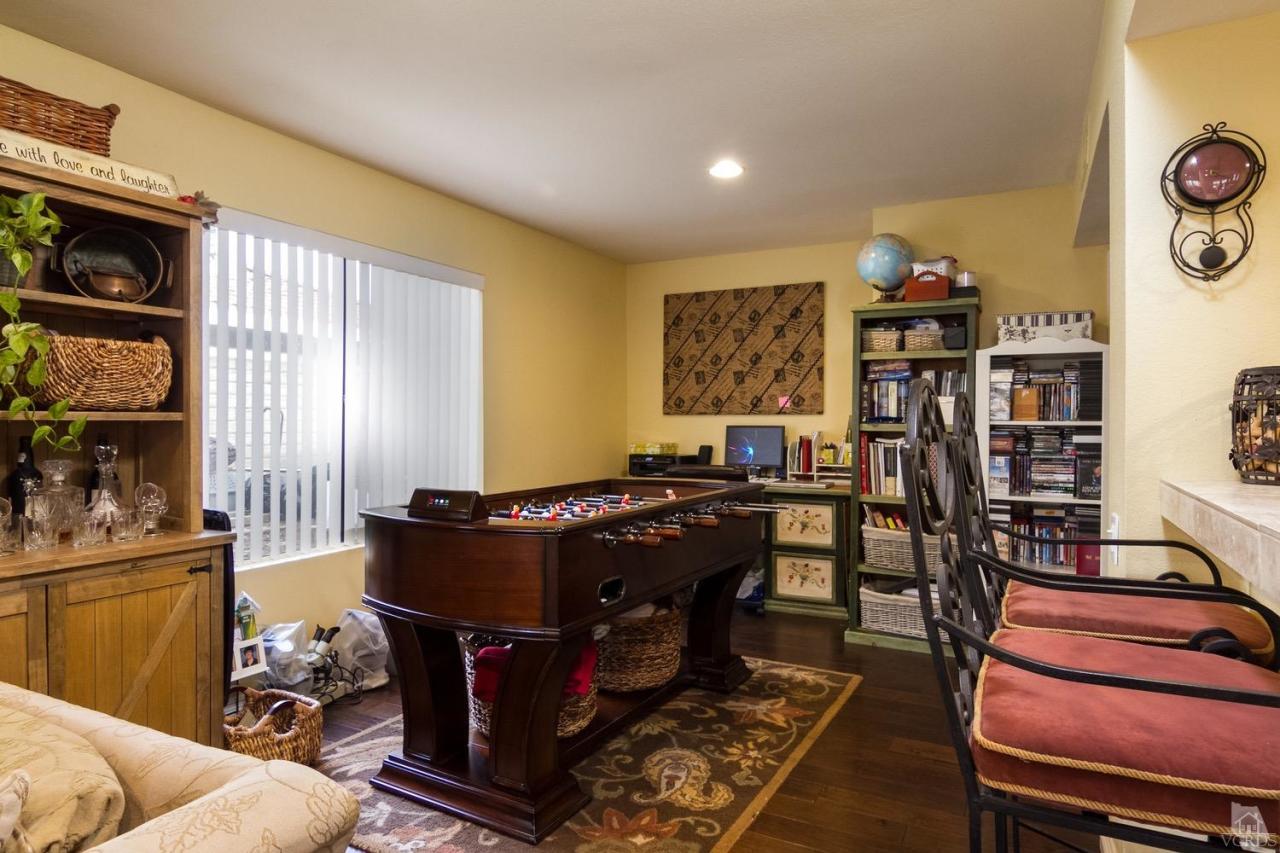 12685 Crystal Ranch Road Moorpark, CA 93021 - Photo 13 of 25 a living room with furniture and a book shelf