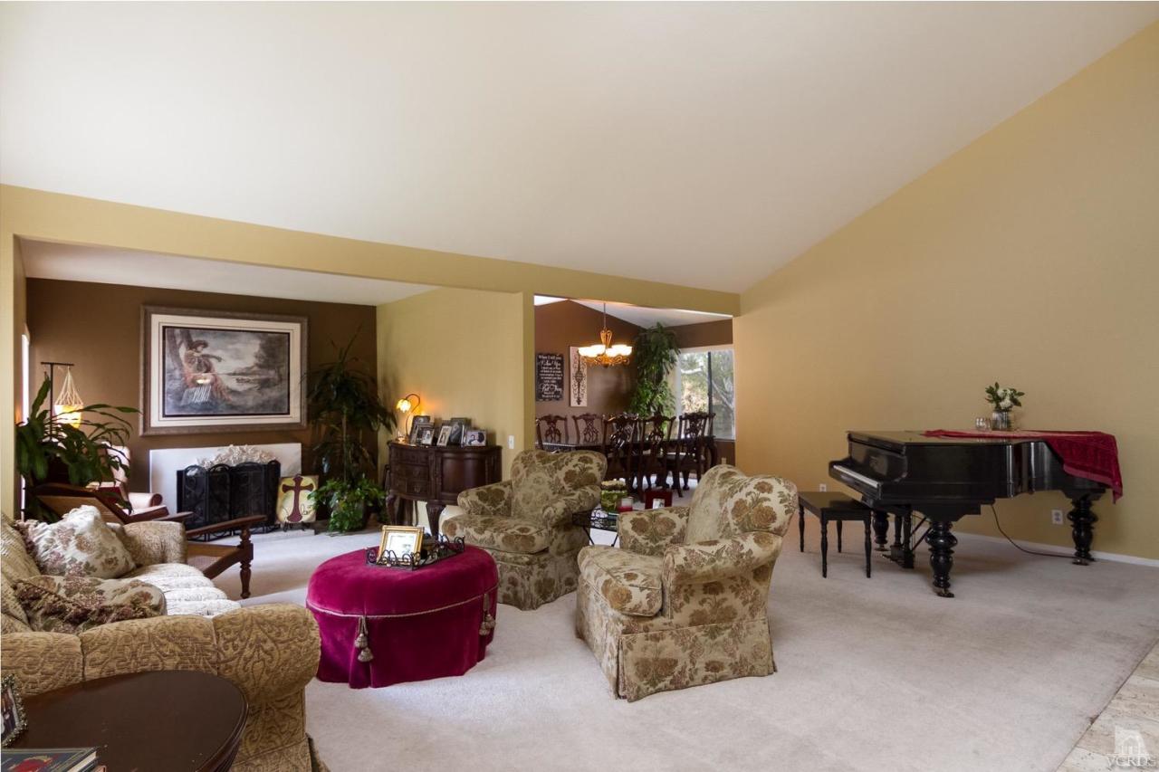 12685 Crystal Ranch Road Moorpark, CA 93021 - Photo 3 of 25 a living room with furniture and a fireplace