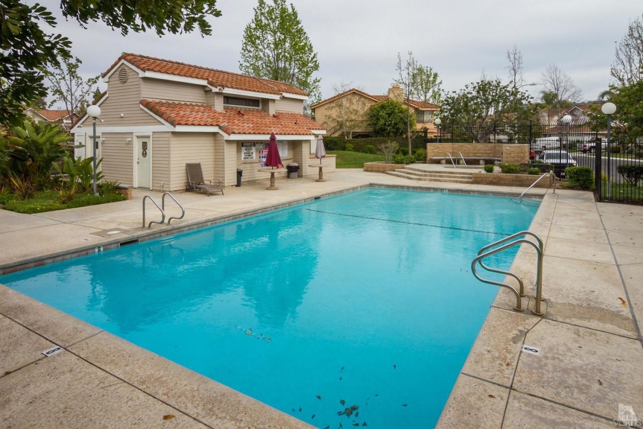 12685 Crystal Ranch Road Moorpark, CA 93021 - Photo 24 of 25 a view of a house with pool and chairs