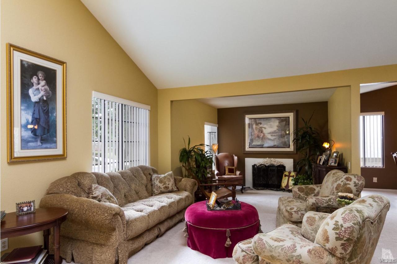 12685 Crystal Ranch Road Moorpark, CA 93021 - Photo 4 of 25 a living room with furniture a fireplace and a large window