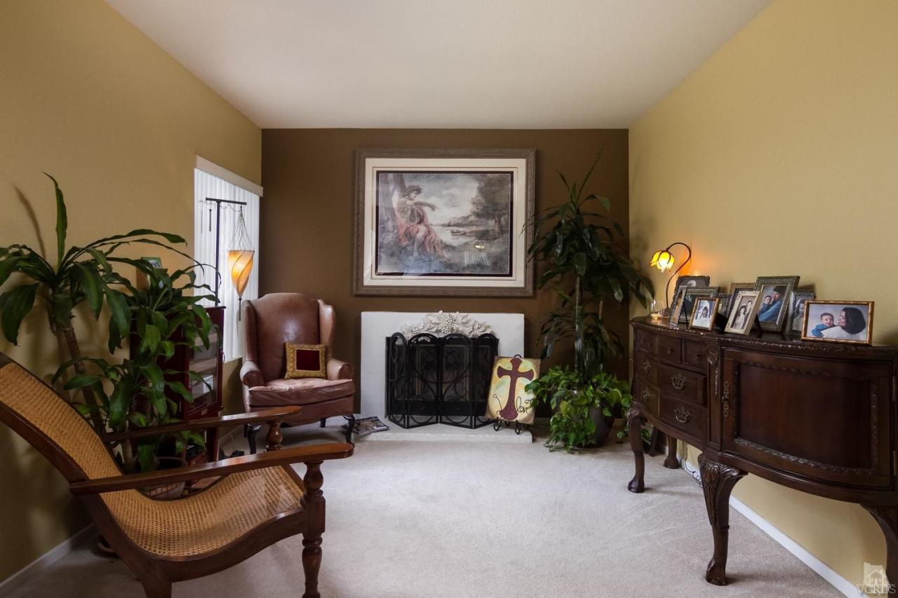 12685 Crystal Ranch Road Moorpark, CA 93021 - Photo 5 of 25 a living room with furniture and a fireplace