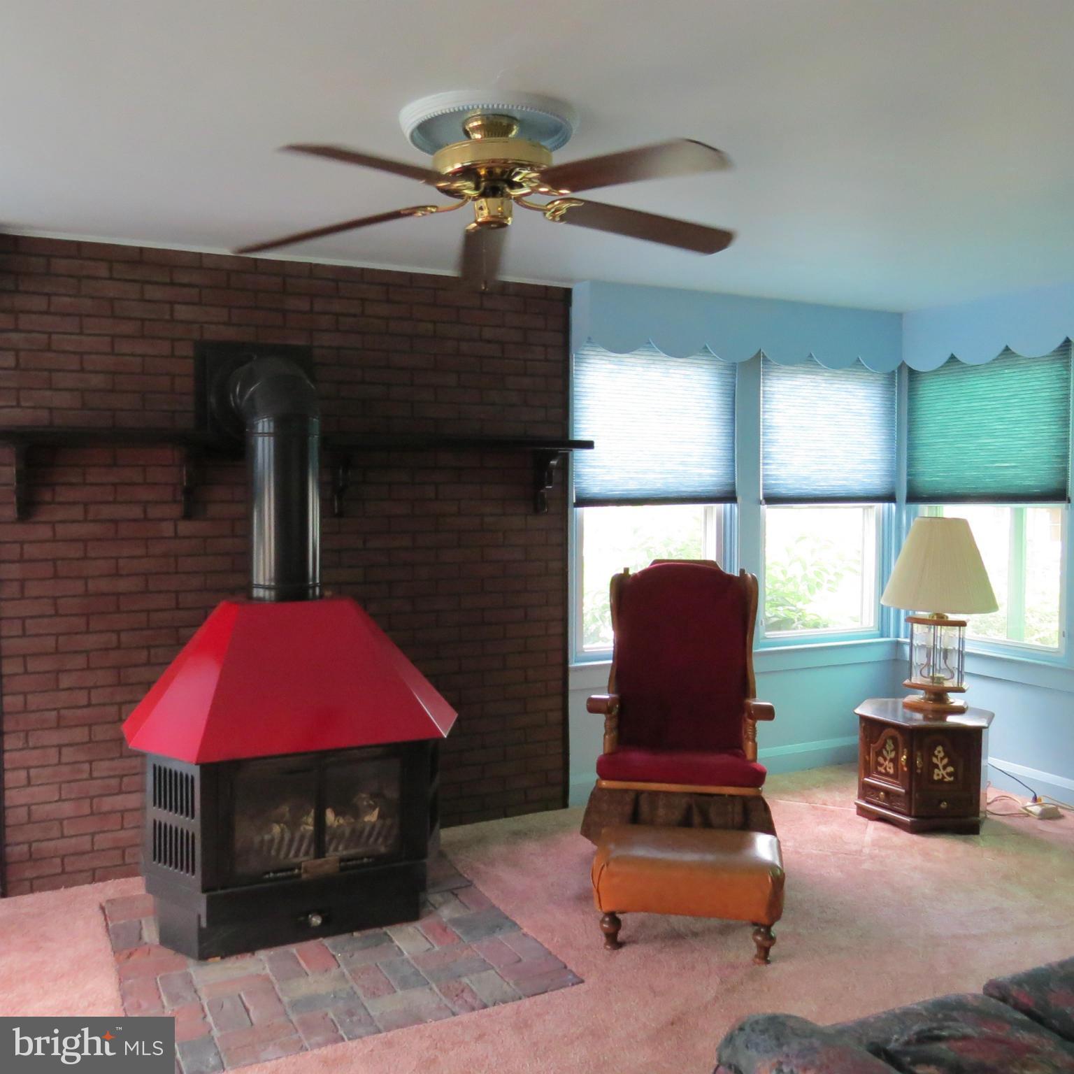 17 Township Road Dundalk, MD 21222 - Photo 2 of 25 a living room with furniture and a fireplace
