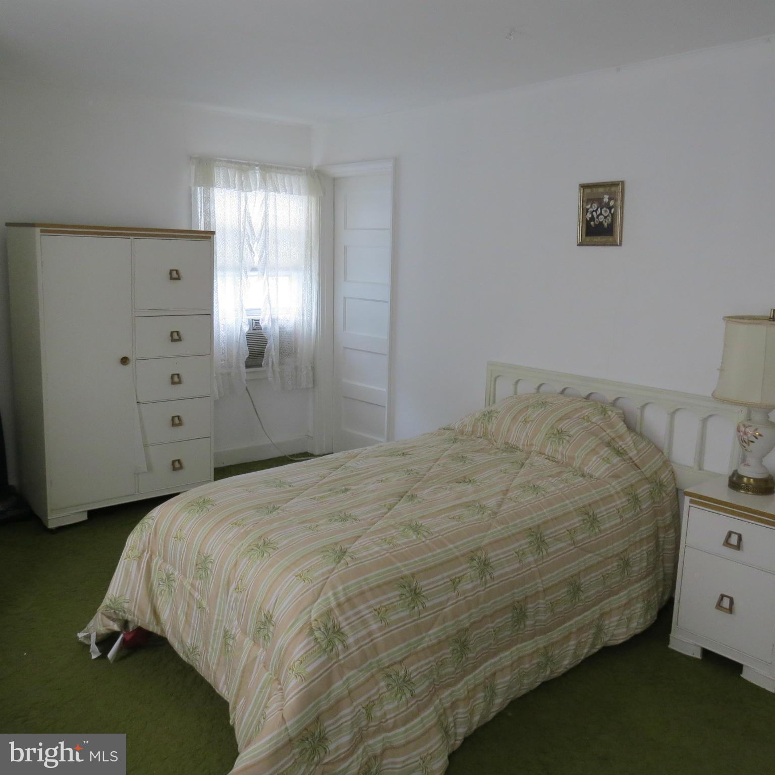 17 Township Road Dundalk, MD 21222 - Photo 11 of 25 a bedroom with a bed and a night stand
