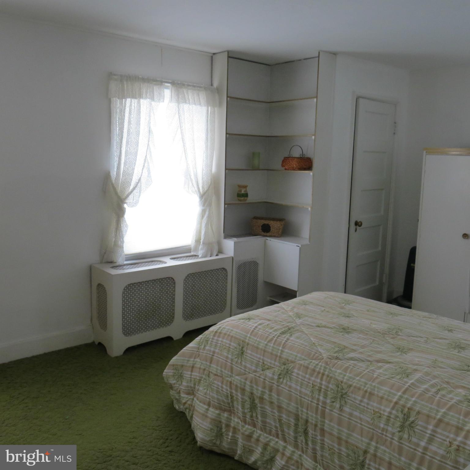 17 Township Road Dundalk, MD 21222 - Photo 12 of 25 a bedroom with a bed and a window