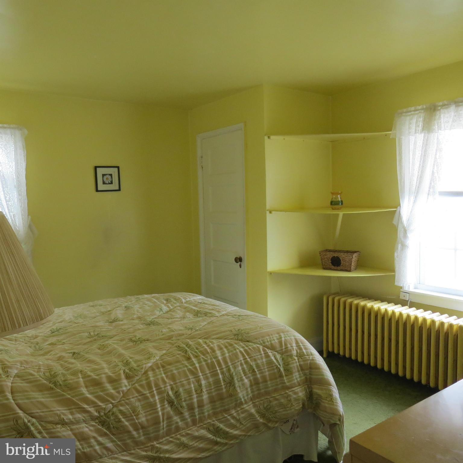 17 Township Road Dundalk, MD 21222 - Photo 14 of 25 a bedroom with a bed and a window