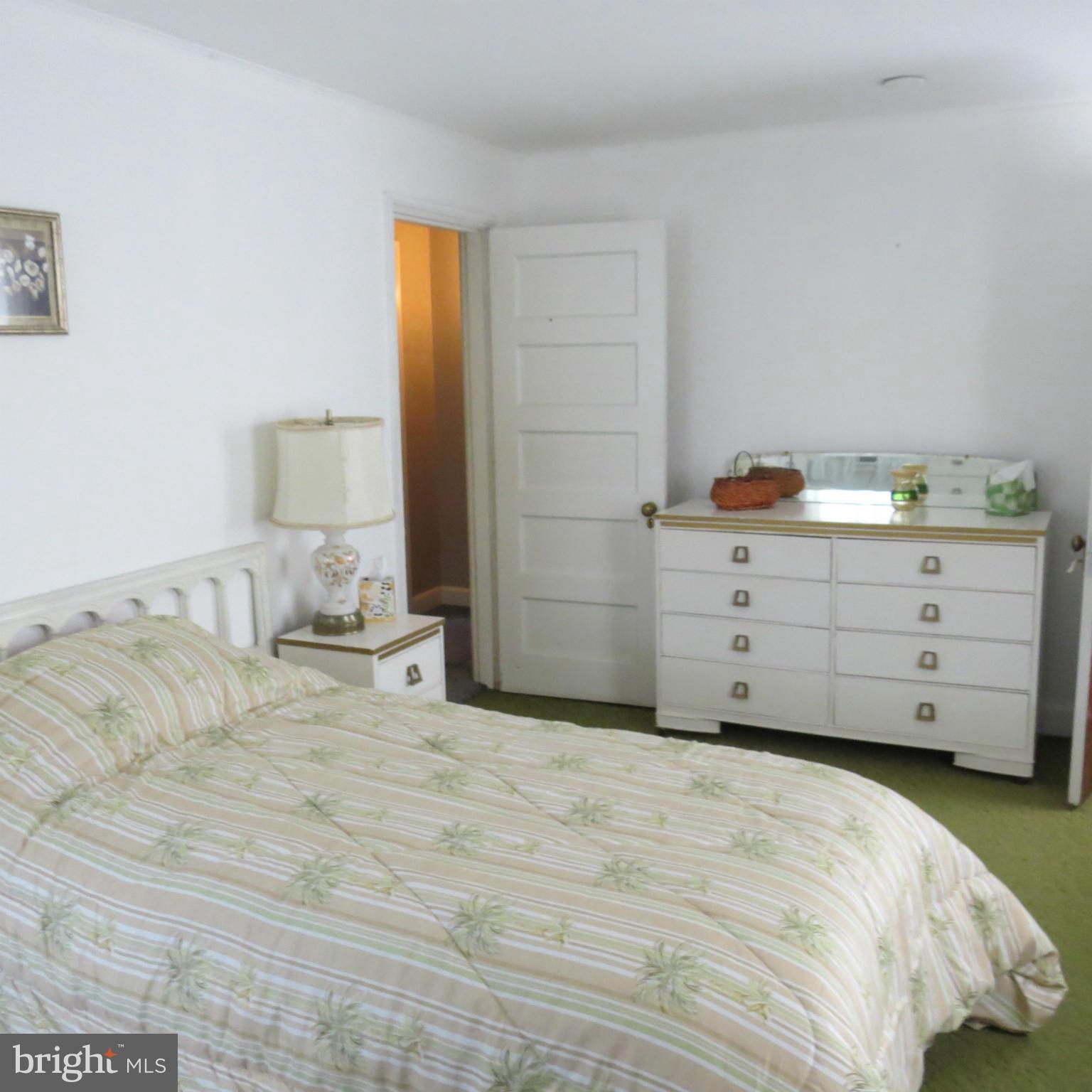 17 Township Road Dundalk, MD 21222 - Photo 5 of 25 a bed room with a bed and a night stand