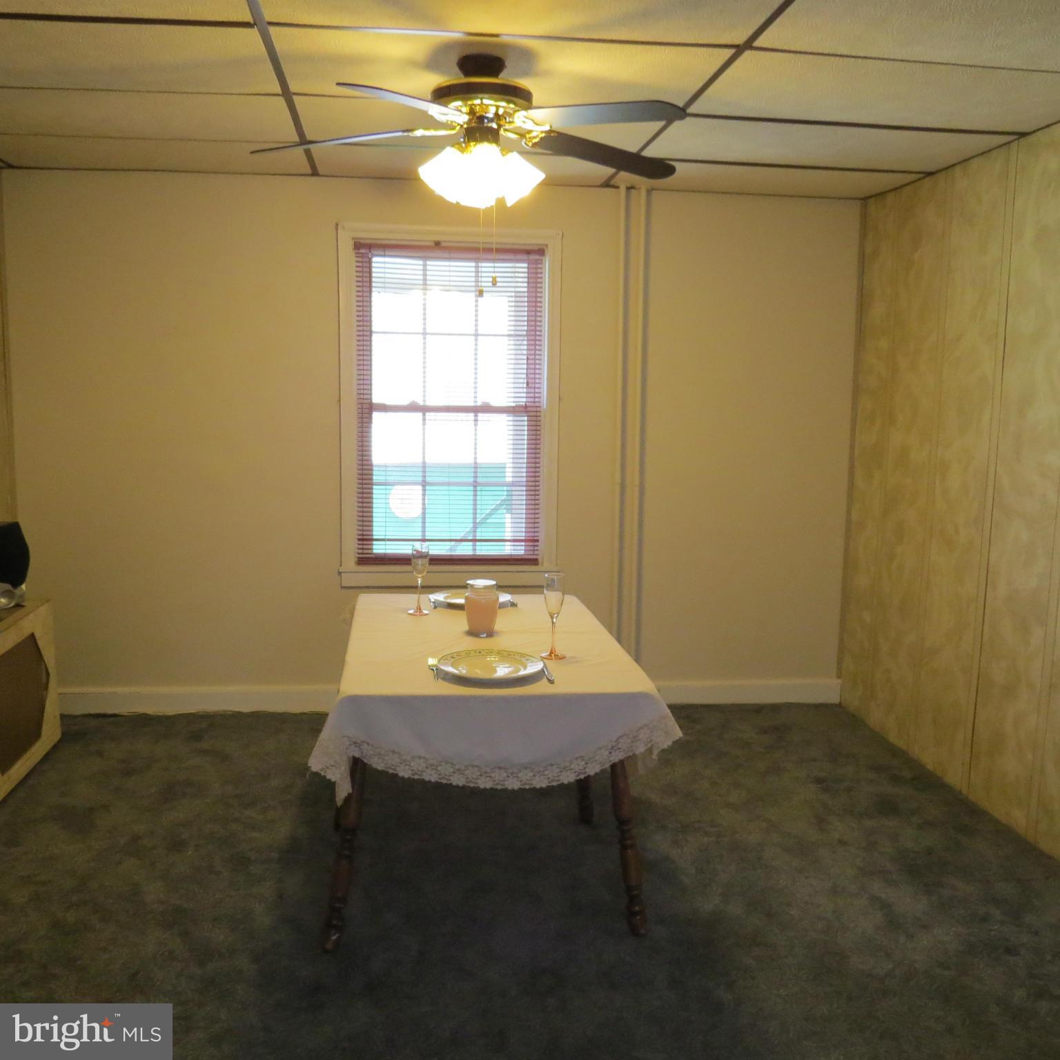 17 Township Road Dundalk, MD 21222 - Photo 9 of 25 a room with a table and chairs