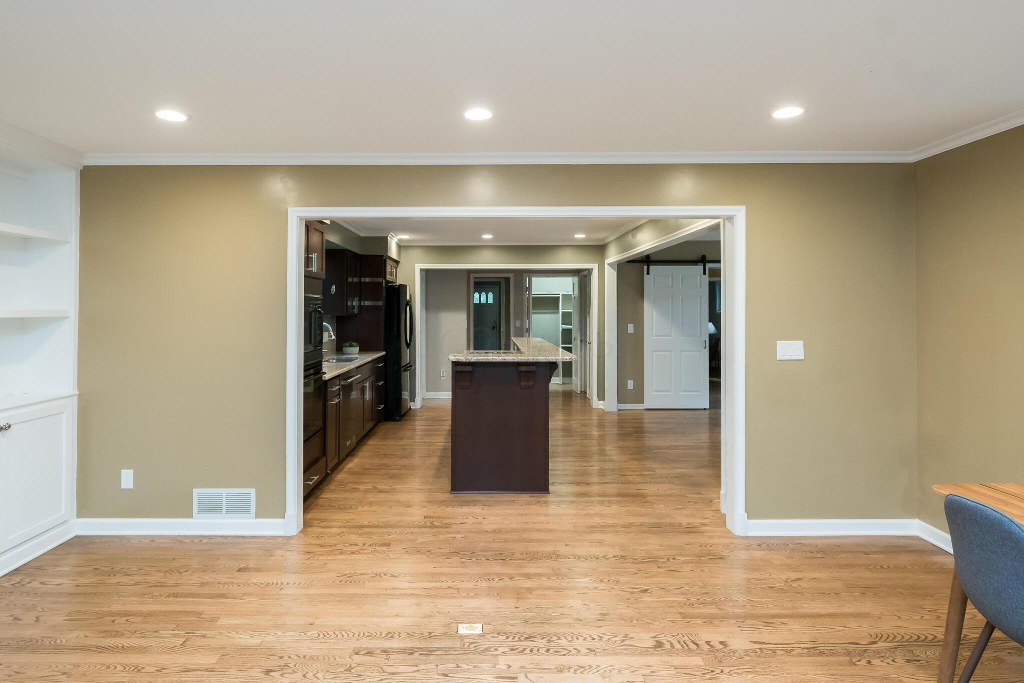 356 Gudrun Road Columbus, OH 43202 - Photo 16 of 53 View from media room to kitchen. Built in bookcases in media room