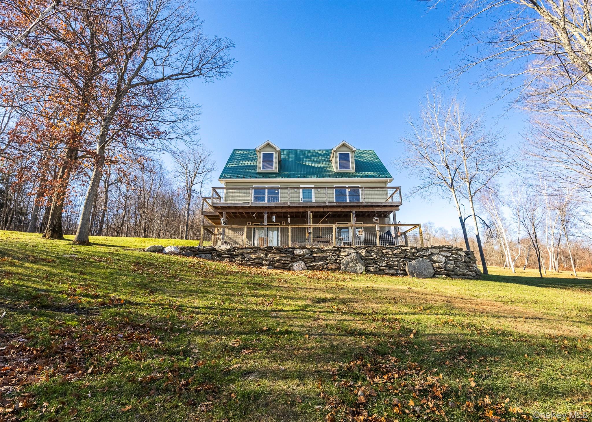 641 Smithfield Road Millerton, NY 12546 - Photo 2 of 20 a view of a large house with a big yard and large trees