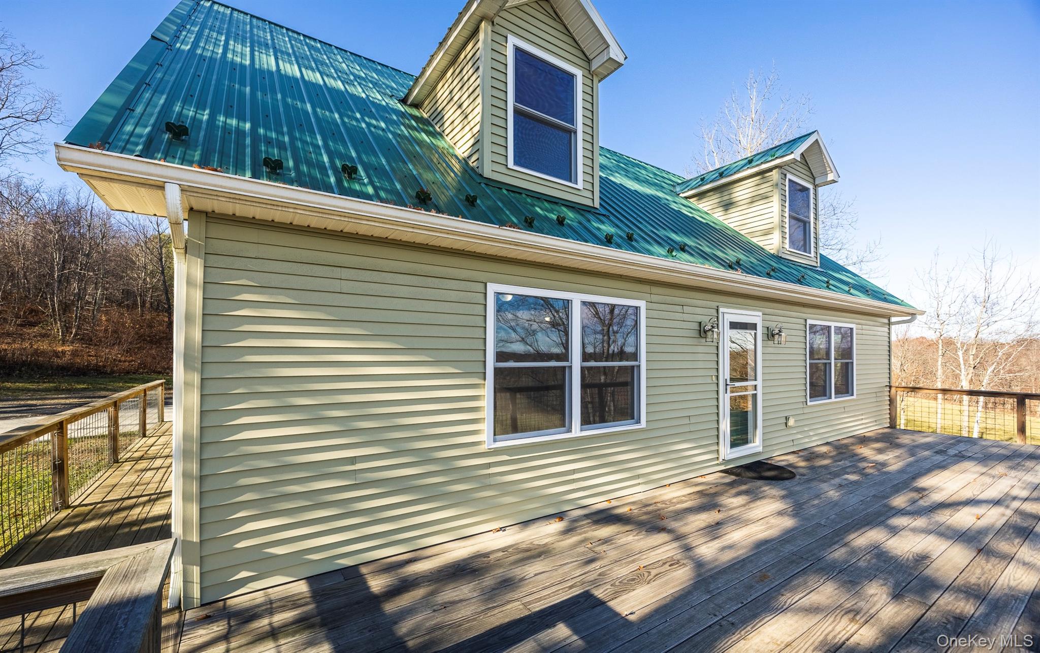 641 Smithfield Road Millerton, NY 12546 - Photo 2 of 22 a view of a house with a balcony