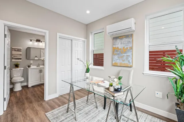 a view of a livingroom with furniture and hardwood floor