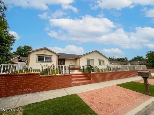 a view of house with swimming pool yard and outdoor seating
