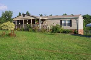 1336 Rockcreek Road Sandy Level, VA 24161 - Photo 1 of 19 a front view of a house with a yard