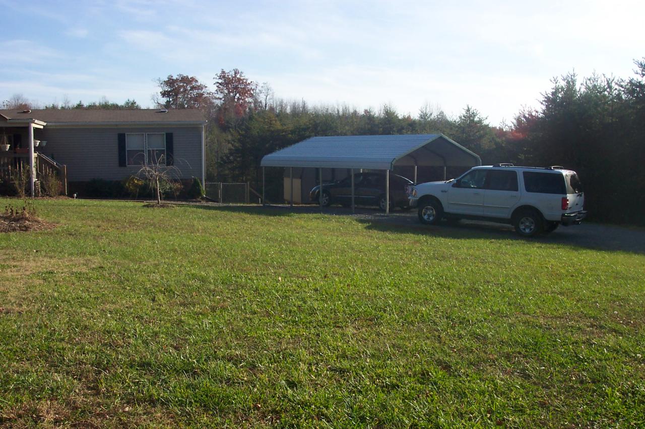 1336 Rockcreek Road Sandy Level, VA 24161 - Photo 19 of 19 a front view of a house with a garden and yard
